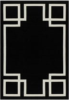 Czarny dywan Hampton w stylu Art Deco z białym geometrycznym wzorem ramki, wykonany w technologii łatwego czyszczenia.