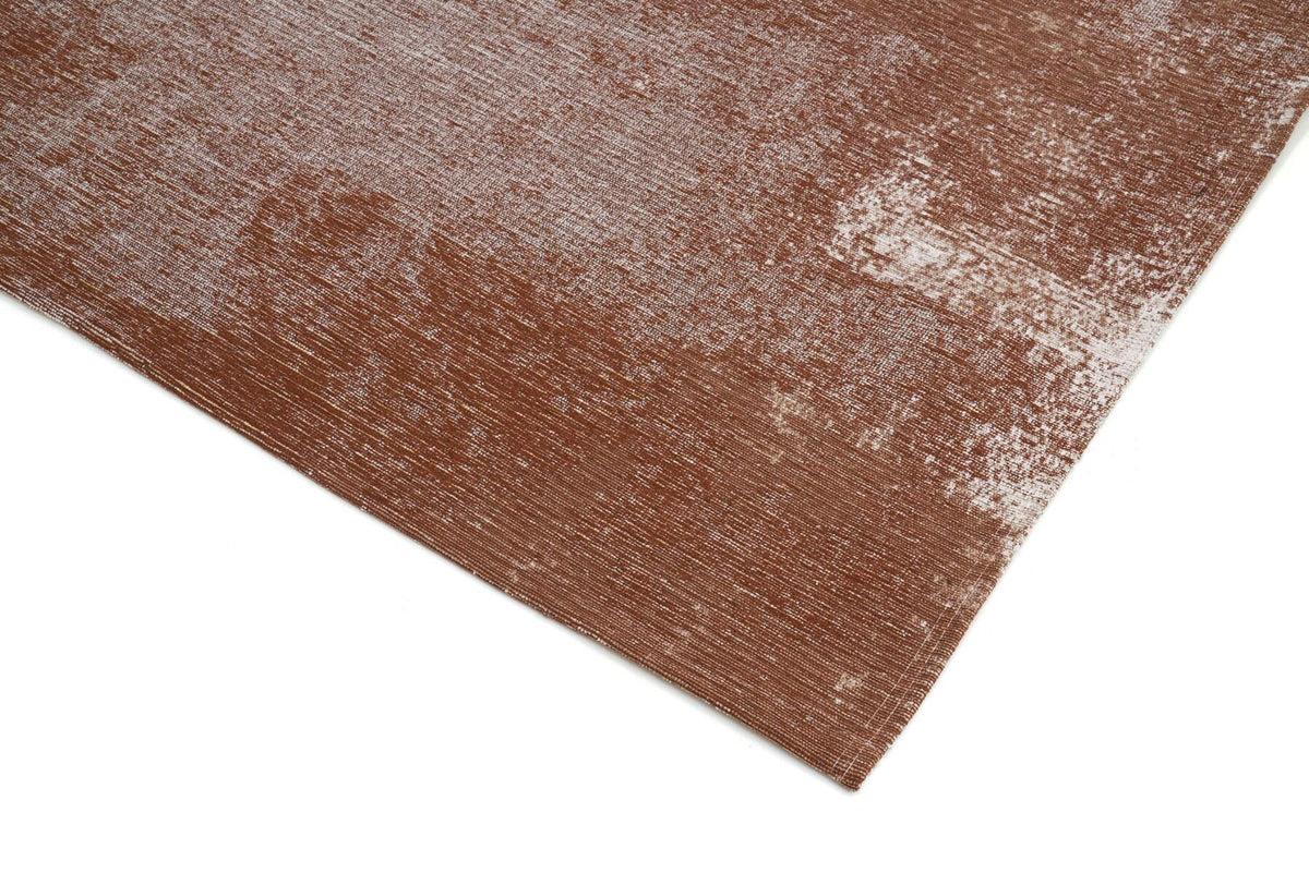 Nowoczesny dywan Rust Copper w kolorze miedzianym z przetarciami w stylu vintage i antypoślizgowym podkładem.