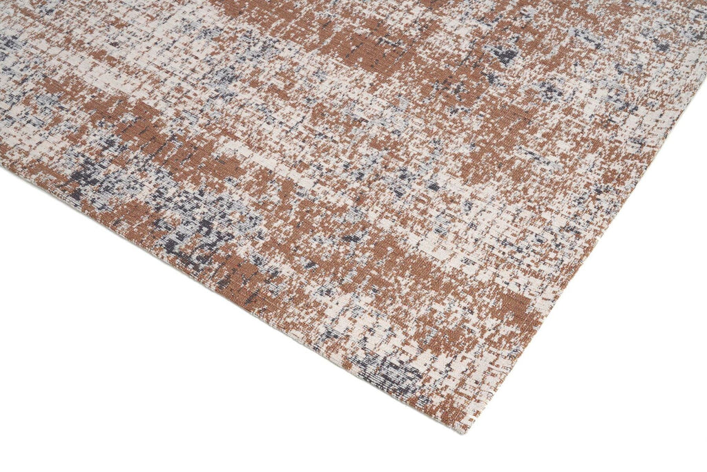 Nowoczesny dywan Rustic Beige z kolekcji Magic Home o beżowo-brązowym wzorze z efektem postarzania i antypoślizgowym spodem.