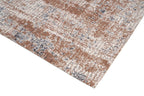Nowoczesny dywan Rustic Beige z kolekcji Magic Home o beżowo-brązowym wzorze z efektem postarzania i antypoślizgowym spodem.